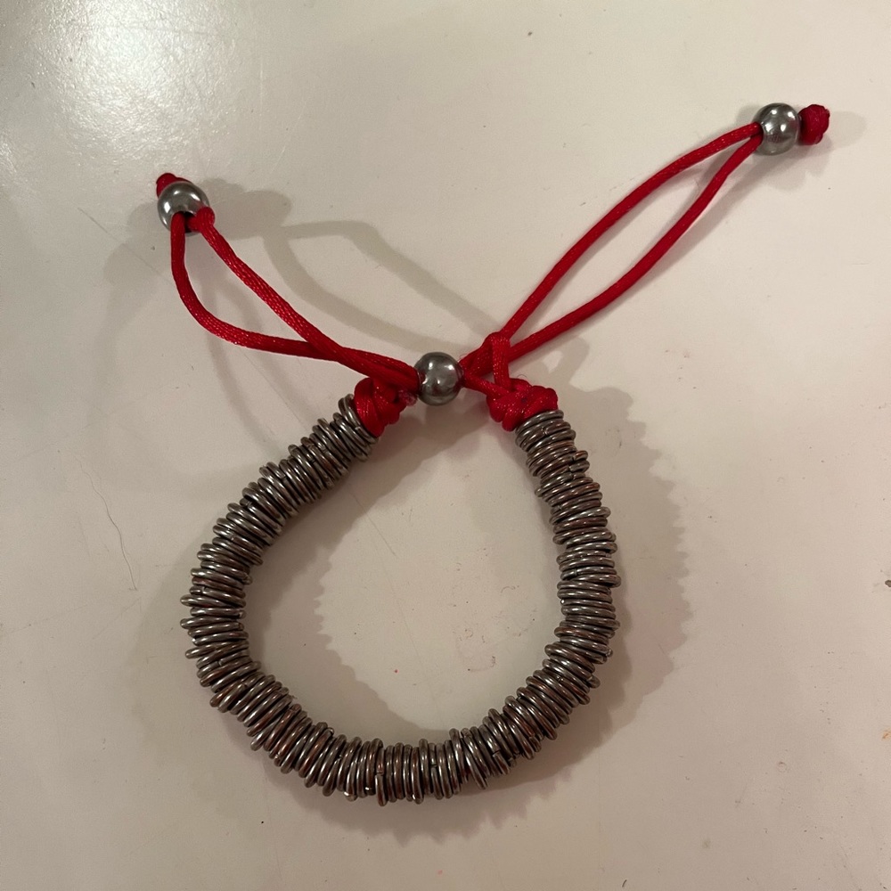 Silver coloured links on red string - Picture 3 of 4